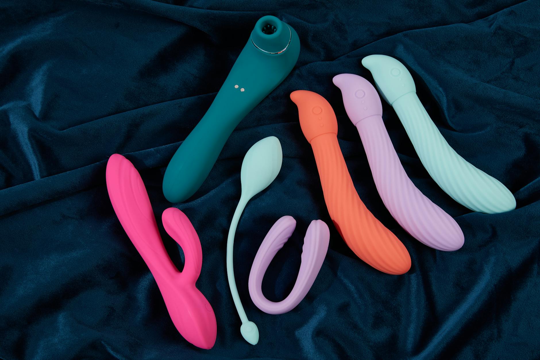 Woman holding clitoral vibrators, exploring sensation and pleasure